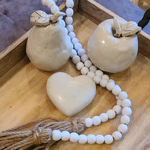 Load image into Gallery viewer, A simple must have coffee table styling piece, these wooden beads add a touch of feel-good style to your living space. Inspired by Mala beads used for prayer and meditation, they encourage mindfulness, peace, and clarity. Dimensions: 48"L x 0.5"W x 0.5"H Materials: Paulownia Wood, Jute rope tassels - Carved from paulownia wood and finished with a white wash