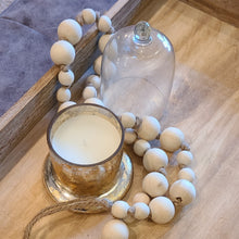 Load image into Gallery viewer, A simple must have coffee table styling piece, these wooden beads add a touch of feel-good style to your living space. Inspired by Mala beads used for prayer and meditation, they encourage mindfulness, peace, and clarity. Dimensions: 36"L x 1"W x 1"H Materials: Paulownia Wood, Jute rope - Carved from paulownia wood and finished with a natural wash