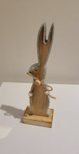 Load image into Gallery viewer, This whymsical wooden bunny makes a fun addition to your Easter decor. The adorable button detail & soft mint painted edge are the perfect complement to any spring mantel, countertop, tabletop or coffee table.  Add it to your Easter gifts for some bunny special.  Size:  2.5 W x 8 H x 1.5 D  Material: Natural Wood