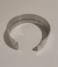 Load image into Gallery viewer, Quote inside:  "Well behaved women seldom make history."  Made of aluminum each cuff is hypo-allergenic, lead and nickel free, with no toxic finishes. Everything is printed with a permanent dye which gives a nice vibrant finish.   Cuffs are super light weight and adjustable allowing them to be molded to fit most sizes.   Each cuff is 3/4" thick and are perfect for stacking.