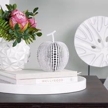 Load image into Gallery viewer, This charming resin white apple figure features a painted debossed textured dot pattern to highlight its modern form, giving it a twist to traditional apple decorations.  This whimsical decorative accent makes a fun, yet bold statement when perched on a shelf or table in the kitchen or living room. Display it on its own or pair it with its complementary black resin pear for a unique look as shown.  Perfect for Birthdays, Housewarming, Bridal Shower or Teachers gift.  Size:  5d x 6.25h"  Material:  Polyresin