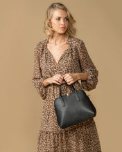 Load image into Gallery viewer, This Black Candice Handbag is a classic style.  Beautiful and easy to carry and sits perfectly when placed down.  A stunning design makes this perfectly sized handbag a must have!  Features:  1 x Phone Pocket 1 Zip Pocket 1 Flat Pocket Internal lining: Black/White Stripe Lining Strap Height: 13cm Extension strap: 110cm Adjustable Detachable Closure: Secure Zip Material: Vegan Leather  Hardware: Light Gold  Dimensions: W28 x H24.5 x D11cm