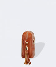Load image into Gallery viewer, This Tan Holly crossbody bag is the ultimate accessory.   Stylish, yet practical.  Great for travel and you will be amazed at how much fits in there.  Features:  1 Zip Pocket 1 Flat Pocket Internal lining - Black/White Stripe Strap: 110cm Adjustable Detachable Closure: Zip Closure Material: Suedette Vegan Leather  Hardware: Light Gold  Dimensions: W24 x H16 x D8 cm