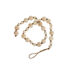 Load image into Gallery viewer, A simple must have coffee table styling piece, these wooden beads add a touch of feel-good style to your living space. Inspired by Mala beads used for prayer and meditation, they encourage mindfulness, peace, and clarity. Dimensions: 36"L x 1"W x 1"H  Materials: Paulownia Wood, Jute rope - Carved from paulownia wood and finished with a natural wash
