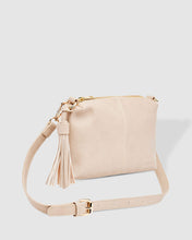 Load image into Gallery viewer, The Baby Daisy Putty Crossbody is a small, unstructured body style bag, with a relaxed look and tassel detail for some fun and spark. It's just the right size and feels so soft. For travel or work, throw Baby Daisy in your larger tote and be ready for anything. Features: 1 x Zip Pocket 2 x Flat Pockets Internal lining - Black/White Stripe Extension strap: 110cm Adjustable Detachable Closure: Secure Zip Material: Vegan Leather Hardware: Light Gold Dimensions: W25 x H16 x D6 cm