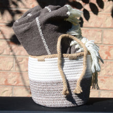 Load image into Gallery viewer, Small woven braided basket - 8" diameter. Shown with wool blanket inside