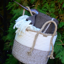 Load image into Gallery viewer, Medium woven braided basket - 9.5" diameter. Shown with wool blanket inside