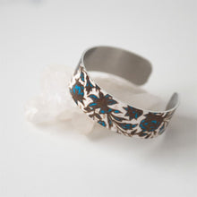 Load image into Gallery viewer, We have picked some of our favourite pieces and paired them with an inspirational saying that resonates with us. We know you will love this piece as much as we do.   Quote inside:  "Life is a story. Write well. Edit often."  Made of aluminum each cuff is hypo-allergenic, lead and nickel free, with no toxic finishes. Everything is printed with a permanent dye which gives a nice vibrant finish.   Cuffs are super light weight and adjustable allowing them to be molded to fit most sizes.   Each cuff is 3/4" thic