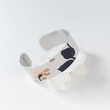 Load image into Gallery viewer, We have picked some of our favourite pieces and paired them with an inspirational saying that resonates with us. We know you will love this piece as much as we do.   Quote inside:  "Be peaceful, be happy, be whole."  Made of aluminum each cuff is hypo-allergenic, lead and nickel free, with no toxic finishes. Everything is printed with a permanent dye which gives a nice vibrant finish.   Cuffs are super light weight and adjustable allowing them to be molded to fit most sizes.   Each cuff is 3/4" thick .