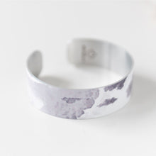 Load image into Gallery viewer, We have picked some of our favourite pieces and paired them with an inspirational saying that resonates with us. Quote inside: "Life is a story. Write well. Edit often." Made of aluminum each cuff is hypo-allergenic, lead and nickel free, with no toxic finishes. Everything is printed with a permanent dye which gives a nice vibrant finish. Cuffs are super light weight and adjustable allowing them to be molded to fit most sizes. Each cuff is 3/4" thick