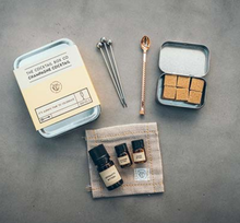 Load image into Gallery viewer, Each Box Includes a custom designed fancy pants bartender's spoon & muddler, 3 cocktail picks and also a hand-knit cocktail napkin for spillage. Champagne Cocktail Kit This beautifully designed cocktail kit serves 6 hand-crafted premium Champagne Cocktails. Includes high-quality organic ingredients: lavender, lemon & aromatic bitters as well as 6 perfectly cubed pieces of raw cane sugar. Alcohol Not Included. Intended for those of legal drinking age.