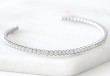 Load image into Gallery viewer, Cleo Goddess Metal Cuff Bracelet has an understated design that is both simple yet elegant. This exquisite piece looks amazing when worn on its own or as part of the gorgeous Lainey Stack , Exclusively from Kinsley Armelle. Details: Style: Cuff Material: Silver Ion Plated Stainless Steel Size: 6.5 - 8 Inch Circumference