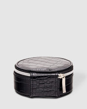 Load image into Gallery viewer, Organize your essential items easily with three ring rolls, two compartments, an elasticated slip pocket and a press stud tab for earrings. Structured and protected, this beautiful jewellery case will be your new travel companion. Features: 3 Ring Rolls 2 Compartments, 1 Elastic Slip Pocket 1 Press Stud Earring Band Lining: Black/White Stripe Closure: Secure Zip Material: Vegan Leather Hardware: Light Gold Dimensions: W9.6 x H4.3 x D9.6cm. Shown: Black