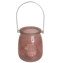 Load image into Gallery viewer, This Pink Glass Jar Tealight Candle Holder is a stylish home decor for lovers of pink and glamorous interiors. These will also make an excellent outdoor decor. It makes an excellent accessory and gift idea for Valentine's Day, or any occasion, with it's "Enjoy Life, Love, Living" inscription. Perfect for holding a little tealight or use for storing makeup, office or art supplies like brushes and markers. Use freestanding or hang anywhere from the metal handle. Size: 3.5" H x 3.5"D *Includes (1) tealight
