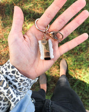 Load image into Gallery viewer, This Quartz Bangle Keychain features dual raw quartz stones on a smooth rose gold ion-plated stainless steel pendant. The stones are rigid rocks to add that extra flare to your style. Exclusively from Kinsley Armelle.   Details:  Material: 18K Rose Gold Ion Plated Stainless Steel Size: 3 Inch Long