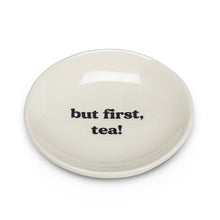 Load image into Gallery viewer, Get your priorities in order with the help of this “But First, Tea” Small Plate. Crafted out of stoneware with a glossy ivory finish, this plate is the perfect size for tea bags or your favourite tea-time treats.   Pair it with any of our tea sets for a perfect gift.  Size:  3.5" D  Material:  Stoneware  Colour:  Ivory