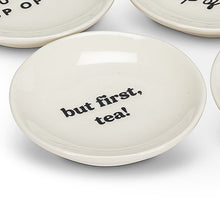 Load image into Gallery viewer, Get your priorities in order with the help of this “But First, Tea” Small Plate. Crafted out of stoneware with a glossy ivory finish, this plate is the perfect size for tea bags or your favourite tea-time treats.   Pair it with any of our tea sets for a perfect gift.  Size:  3.5" D  Material:  Stoneware  Colour:  Ivory