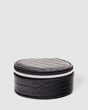 Load image into Gallery viewer, Organize your essential items easily with three ring rolls, two compartments, an elasticated slip pocket and a press stud tab for earrings. Structured and protected, this beautiful jewellery case will be your new travel companion. Features: 3 Ring Rolls 2 Compartments, 1 Elastic Slip Pocket 1 Press Stud Earring Band Lining: Black/White Stripe Closure: Secure Zip Material: Vegan Leather Hardware: Light Gold Dimensions: W9.6 x H4.3 x D9.6cm. Shown: Black