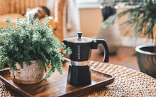 Load image into Gallery viewer, This Milano espresso machine is an elegant black and is made from food safe aluminium with a heat resistant mahogany dip handle and knob, and a non-toxic silicon gasket seal. Medium-fine coffee grounds should be used with the espresso pot.
