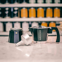 Load image into Gallery viewer, This Milano espresso machine is an elegant black and is made from food safe aluminium with a heat resistant mahogany dip handle and knob, and a non-toxic silicon gasket seal. Medium-fine coffee grounds should be used with the espresso pot.