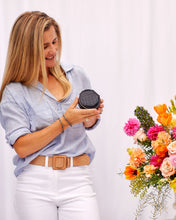 Load image into Gallery viewer, Organize your essential items easily with three ring rolls, two compartments, an elasticated slip pocket and a press stud tab for earrings. Structured and protected, this beautiful jewellery case will be your new travel companion. Features: 3 Ring Rolls 2 Compartments, 1 Elastic Slip Pocket 1 Press Stud Earring Band Lining: Black/White Stripe Closure: Secure Zip Material: Vegan Leather Hardware: Light Gold Dimensions: W9.6 x H4.3 x D9.6cm. Shown: Black