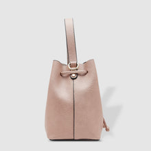 Load image into Gallery viewer, Complete with a drawstring closure, the Sasha is perfect for your next brunch with the girls, or a day out on the town. Wear it your way and sling over your shoulder for a more casual look or carry by her top handle for a dressier option. Features: 1 Slip Pocket Internal lining - Vegan Leather Extension strap: 114-128cm Adjustable Detachable Closure: Magnetic Clasp with Draw String Material: Vegan Leather Hardware: Light Gold Dimensions: W26 x H23 x D14 cm