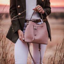 Load image into Gallery viewer, Complete with a drawstring closure, the Sasha is perfect for your next brunch with the girls, or a day out on the town. Wear it your way and sling over your shoulder for a more casual look or carry by her top handle for a dressier option. Features: 1 Slip Pocket Internal lining - Vegan Leather Extension strap: 114-128cm Adjustable Detachable Closure: Magnetic Clasp with Draw String Material: Vegan Leather Hardware: Light Gold Dimensions: W26 x H23 x D14 cm