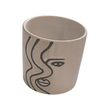 Load image into Gallery viewer, So simple, yet stricking!  This beautiful ceramic planter captures the Face Silhouette so elegantly with its hand-painted design.  It is so versatile it can be used for gorgeous plants, or get creative and use it as a home decor piece on your coffee table or bookshelf.  You can also put it in your office or kitchen for pens, spoons, etc.  Makes a great gift too!  Size:  4" x 4"  Material:  Ceramic