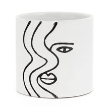 Load image into Gallery viewer, So simple, yet stricking!  This beautiful ceramic planter captures the Face Silhouette so elegantly with its hand-painted design.  It is so versatile it can be used for gorgeous plants, or get creative and use it as a home decor piece on your coffee table or bookshelf.  You can also put it in your office or kitchen for pens, spoons, etc.  Makes a great gift too!  Size:  4" x 4"  Material:  Ceramic