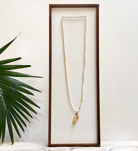 There is no such thing as too many pieces of jewelry, especially sparkly ones with flowing tassels.  Adorn your neck with the latest layered look.  *Paired in picture with the Triptych Necklace  Details:  Swarovski crystal beads strung on elastic Wire-wrapped druzy charm 1.5