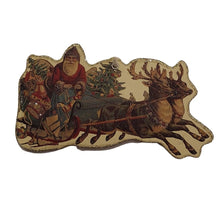 Load image into Gallery viewer, These lovely Cut Out Ornaments are like a window into the beautiful ornaments of Christmases past! The one side features a classic festive character, the other beautiful sparkles — a wonderfully vintage addition to any Christmas tree.   Add them to your gifts for an added special touch.  Size:  4&quot; L x .25&#39; T  Material:  Board.  Shown:  Santa on sled with reindeer
