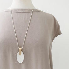 Load image into Gallery viewer, Brushed Silver Oval Pendant with Gold Embellishment Necklace shown on a mannequin 
