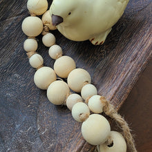 Load image into Gallery viewer, A simple must have coffee table styling piece, these wooden beads add a touch of feel-good style to your living space. Inspired by Mala beads used for prayer and meditation, they encourage mindfulness, peace, and clarity. Dimensions: 36&quot;L x 1&quot;W x 1&quot;H Materials: Paulownia Wood, Jute rope - Carved from paulownia wood and finished with a natural wash

