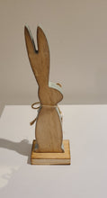 Load image into Gallery viewer, This whymsical wooden bunny makes a fun addition to your Easter decor. The adorable button detail &amp; soft mint painted edge are the perfect complement to any spring mantel, countertop, tabletop or coffee table.  Add it to your Easter gifts for some bunny special.  Size:  2.5 W x 8 H x 1.5 D  Material: Natural Wood
