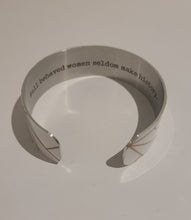 Load image into Gallery viewer, Quote inside:  &quot;Well behaved women seldom make history.&quot;  Made of aluminum each cuff is hypo-allergenic, lead and nickel free, with no toxic finishes. Everything is printed with a permanent dye which gives a nice vibrant finish.   Cuffs are super light weight and adjustable allowing them to be molded to fit most sizes.   Each cuff is 3/4&quot; thick and are perfect for stacking.
