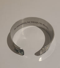 Load image into Gallery viewer, We have picked some of our favourite pieces and paired them with an inspirational saying that resonates with us. We know you will love this piece as much as we do.   Quote inside:  &quot;Be peaceful, be happy, be whole.&quot;  Made of aluminum each cuff is hypo-allergenic, lead and nickel free, with no toxic finishes. Everything is printed with a permanent dye which gives a nice vibrant finish.   Cuffs are super light weight and adjustable allowing them to be molded to fit most sizes.   Each cuff is 3/4&quot; thick
