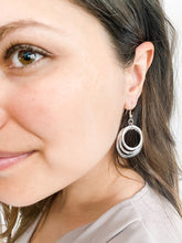 Load image into Gallery viewer, Person wearing silver plated earrings
