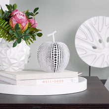 Load image into Gallery viewer, This charming resin white apple figure features a painted debossed textured dot pattern to highlight its modern form, giving it a twist to traditional apple decorations.  This whimsical decorative accent makes a fun, yet bold statement when perched on a shelf or table in the kitchen or living room. Display it on its own or pair it with its complementary black resin pear for a unique look as shown.  Perfect for Birthdays, Housewarming, Bridal Shower or Teachers gift.  Size:  5d x 6.25h&quot;  Material:  Polyresin

