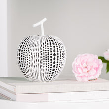 Load image into Gallery viewer, This charming resin white apple figure features a painted debossed textured dot pattern to highlight its modern form, giving it a twist to traditional apple decorations.  This whimsical decorative accent makes a fun, yet bold statement when perched on a shelf or table in the kitchen or living room. Display it on its own or pair it with its complementary black resin pear for a unique look as shown.  Perfect for Birthdays, Housewarming, Bridal Shower or Teachers gift.  Size:  5d x 6.25h&quot;  Material:  Polyresin
