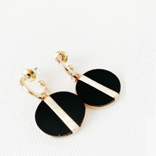 Load image into Gallery viewer, We absolutely adore these delicate black and gold earrings.  Their size and style exudes sophistication and will compliment any outfit.  Details:  Gold plated hoops Resin and gold plated 1&quot; diameter pendant Hypoallergenic Nickel/lead free 3 coats anti-tarnis
