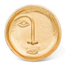 Load image into Gallery viewer, Put a face to your favourite jewelry, keepsakes, coins and more with this unique decorative plate. Crafted out of durable cast iron, and painted gold, this distinctive circular trinket dish features an embossed abstract face that makes for an easy and attractive way to keep track of your keys, coins and small items.  Will definitely make a statement to any decor.  Size:  5&quot; D  Material:  Cast Iron
