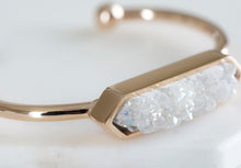 Load image into Gallery viewer, The Quartz Metal Cuff Bangle in Rose Gold features a raw white quartz stone on a smooth rose gold ion-plated stainless steel cuff. The stones are rigid rocks to add that extra flare to your stack or outfit for the night. This bracelet is featured as part of the Lainey Stack , Exclusively from Kinsley Armelle.  Details:  Style: Bangle Material: White Quartz and 18K Rose Gold Ion Plated Stainless Steel Size: 6.5 - 8 Inch Circumference
