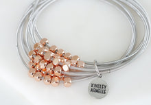 Load image into Gallery viewer, The Ory Metallic Chain Bracelet in Rose Gold is a combination of stacks that includes metallic alloys with rose gold bead embellishments. The bracelet provides a light weight option to mix and match silver and rose gold metals. This bracelet is stunning  alone, but you can also stack it with other bracelets in the Lainey Stack for an even more coordinated look. Exclusively from Kinsley Armelle.   Details:  Style: Stretch Material: Steel + Metal Size: 6.5 - 8 Inch Circumference
