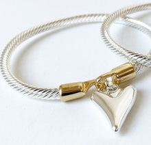Load image into Gallery viewer, Simple, yet elegant, this single metallic silver cuff bracelet, with its gorgeous heart charm, is perfect for any occassion.  2 Colours to choose From:  Silver with Gold Clasp Silver with Rose Gold Clasp Details:  One Size Fits Most Nickel/lead free 3 coats anti-tarnish
