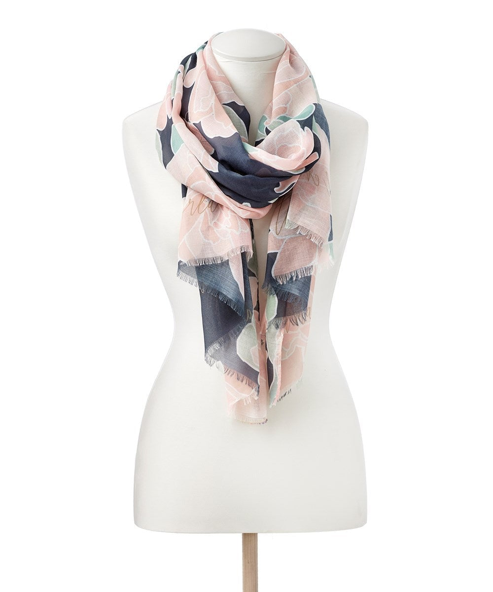 Nothing says spring like this lightweight scarf, styled with a beautiful Lotus print and features the sentiment in gold, 