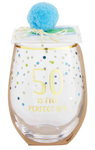 Load image into Gallery viewer, Let&#39;s celebrate the birthday star with our 50th Birthday Wine Glass and Candle Set. The two piece set comes with a foiled stemless wine glass with confetti details. The wine glass features the sentiment &quot;50 is five perfect 10&#39;s&quot; and comes with its own pack of six colorful birthday candles.  Just add cake...and wine of course!!  Set includes:  16oz glass tumbler 6 multi-coloured candles  HAND WASH. DO NOT SOAK. DRY IMMEDIATELY.
