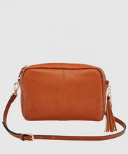 Load image into Gallery viewer, This Tan Holly crossbody bag is the ultimate accessory.   Stylish, yet practical.  Great for travel and you will be amazed at how much fits in there.  Features:  1 Zip Pocket 1 Flat Pocket Internal lining - Black/White Stripe Strap: 110cm Adjustable Detachable Closure: Zip Closure Material: Suedette Vegan Leather  Hardware: Light Gold  Dimensions: W24 x H16 x D8 cm
