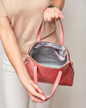 Load image into Gallery viewer, This gorgeous Lizard Pink Candice Handbag is a classic style, with an eyecatching colour. Beautiful and easy to carry and sits perfectly when placed down.  A stunning design makes this perfectly sized handbag a must have!  Features:  1 x Phone Pocket 1 Zip Pocket 1 Flat Pocket Internal lining: Black/White Stripe Lining Strap Height: 13cm Extension strap: 110cm Adjustable Detachable Closure: Secure Zip Material: Vegan Leather  Hardware: Light Gold  Dimensions: W28 x H24.5 x D11cm
