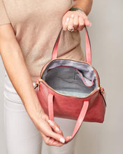Load image into Gallery viewer, This gorgeous Lizard Pink Candice Handbag is a classic style, with an eyecatching colour. Beautiful and easy to carry and sits perfectly when placed down.  A stunning design makes this perfectly sized handbag a must have!  Features:  1 x Phone Pocket 1 Zip Pocket 1 Flat Pocket Internal lining: Black/White Stripe Lining Strap Height: 13cm Extension strap: 110cm Adjustable Detachable Closure: Secure Zip Material: Vegan Leather  Hardware: Light Gold  Dimensions: W28 x H24.5 x D11cm
