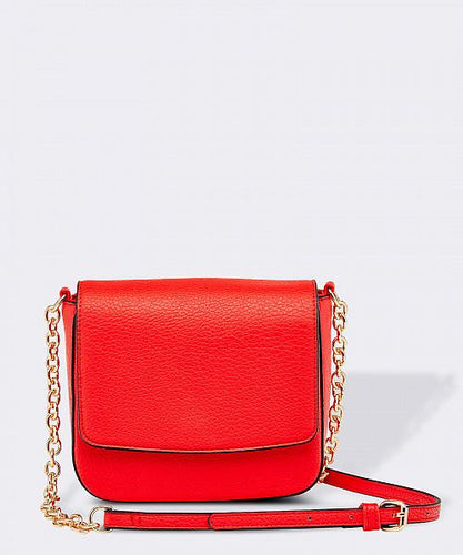 The Red Gemma Bag is an eye catching bag with it's structured body and chain feature.   A striking outfit addition that will carry your essentials on a special night out.     Features:  1 Zip Pockets 1 Card Slot Internal lining - Black/White Stripe Strap: Chain Feature Closure: Magnetic Clasp Material: Vegan Leather  Hardware: Light Gold  Dimensions: W18 x H16.5 x D6 cm